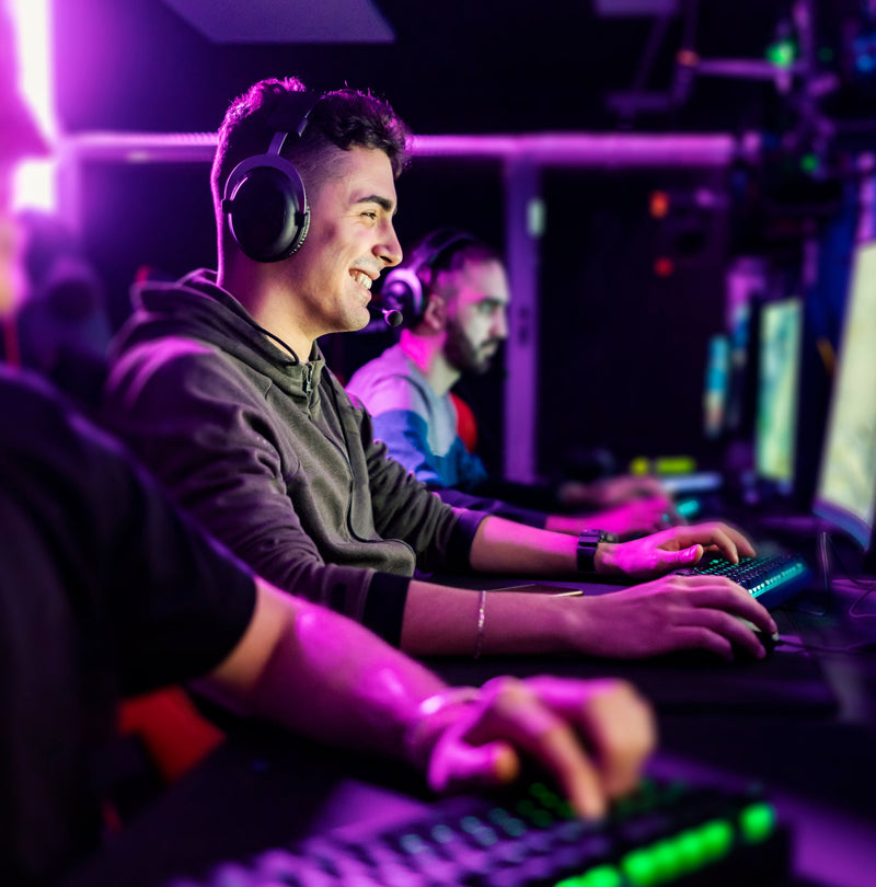 Gamer at PC setup with headset